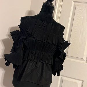Woman’s high fashion off the shoulder top. Medium black